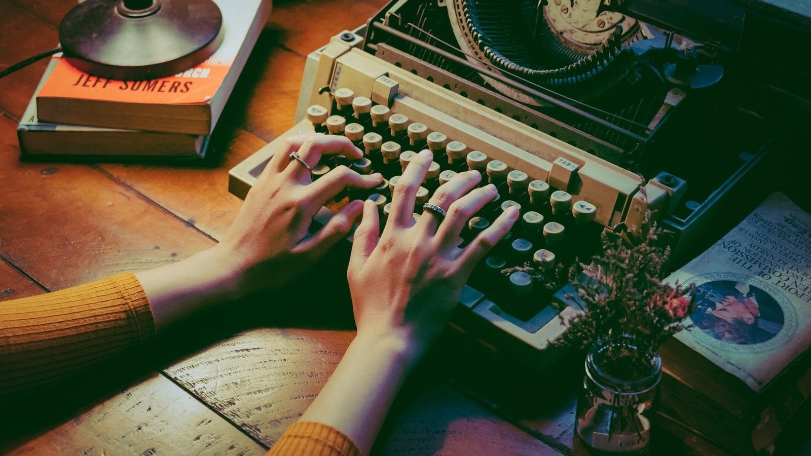 person using typewriter