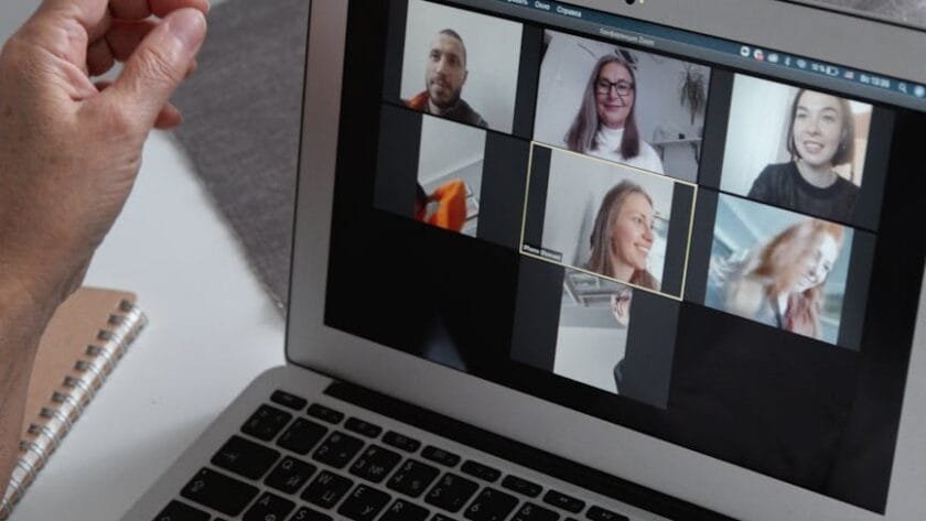 a group of people chatting in a video call in a laptop